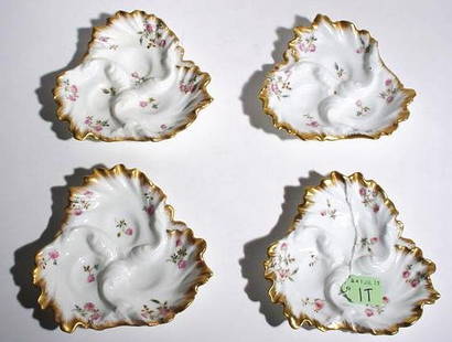 SET OF FOUR DECORATED AND GILDED LIMOGES SMALL DISH: SET OF FOUR DECORATED AND GILDED LIMOGES SMALL DISHES, circa 1900, of trefoil shape, having liberally gilded ruffled edges; 6 inch length (Est. 50-75 the Set)