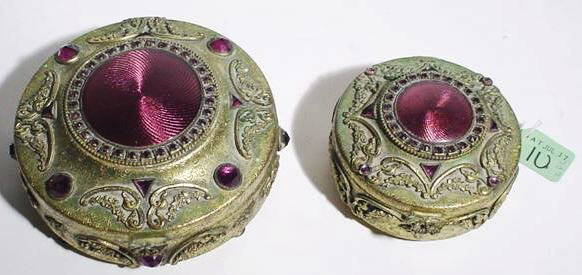 LOT OF 2 DEC. GILT METAL & AMETHYST COL. STONE CIRC: LOT OF TWO DECORATIVE GILT METAL AND AMETHYST COLORED STONE CIRCULAR HINGED BOXES; diameter of largest 5-1/2 inches (Est. 50-80 the Lot)