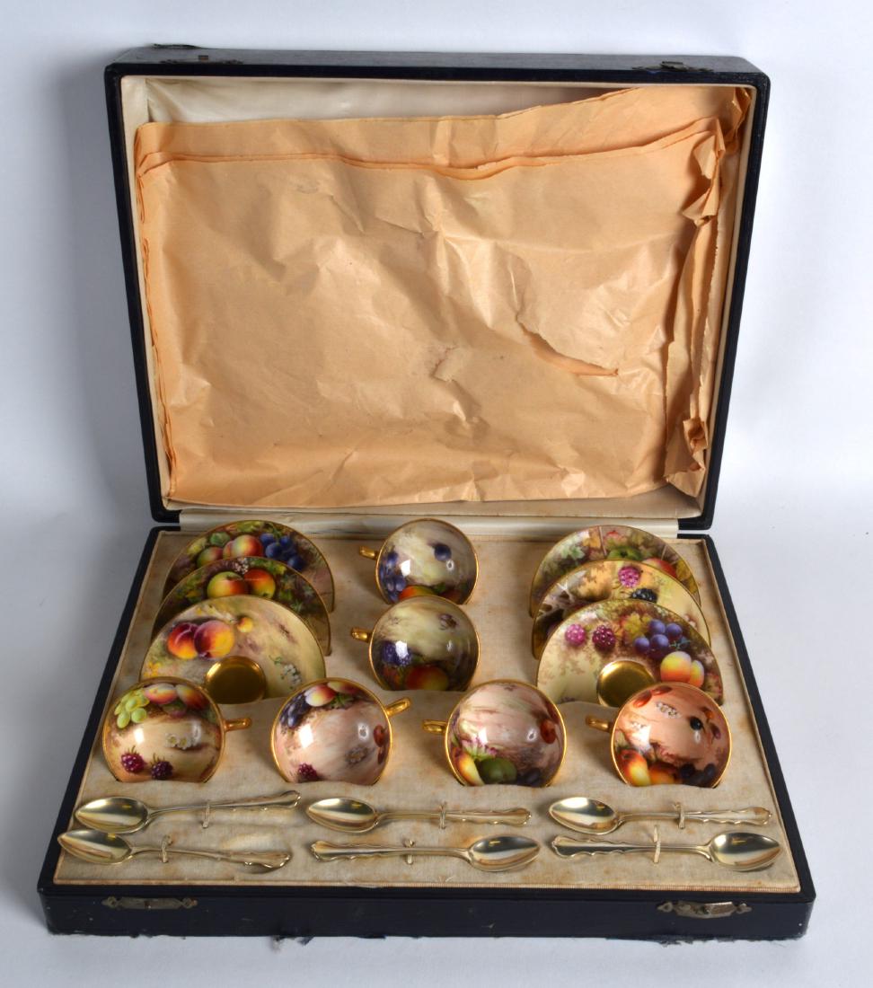A LOVELY ROYAL WORCESTER CASED FRUIT PAINTED CUPS AND: A LOVELY ROYAL WORCESTER CASED FRUIT PAINTED CUPS AND SAUCERS by various artists.