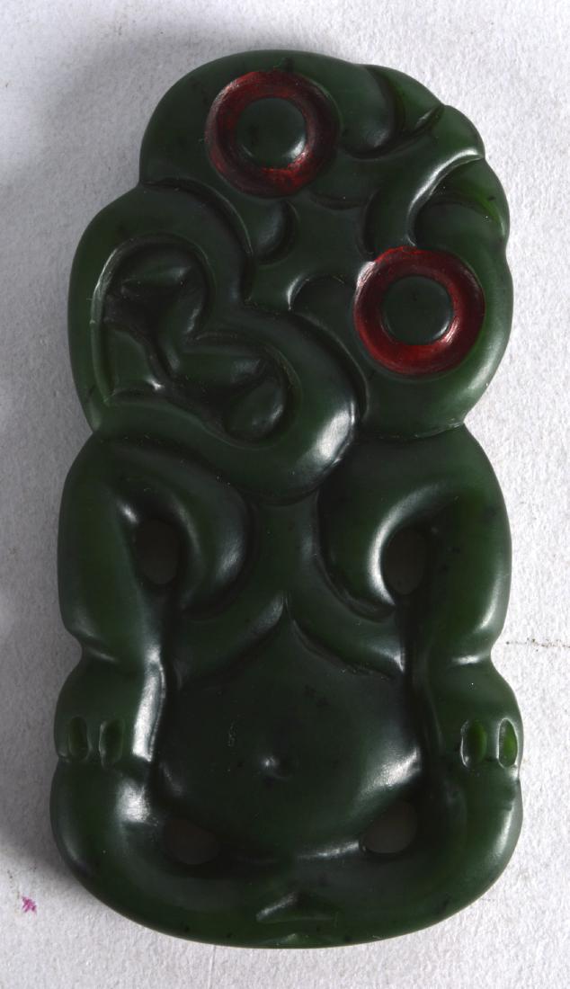 A GOOD LARGE MAORI CARVED JADE TIKI with red painted: A GOOD LARGE MAORI CARVED JADE TIKI with red painted eyes. 2Ins x 4ins.
