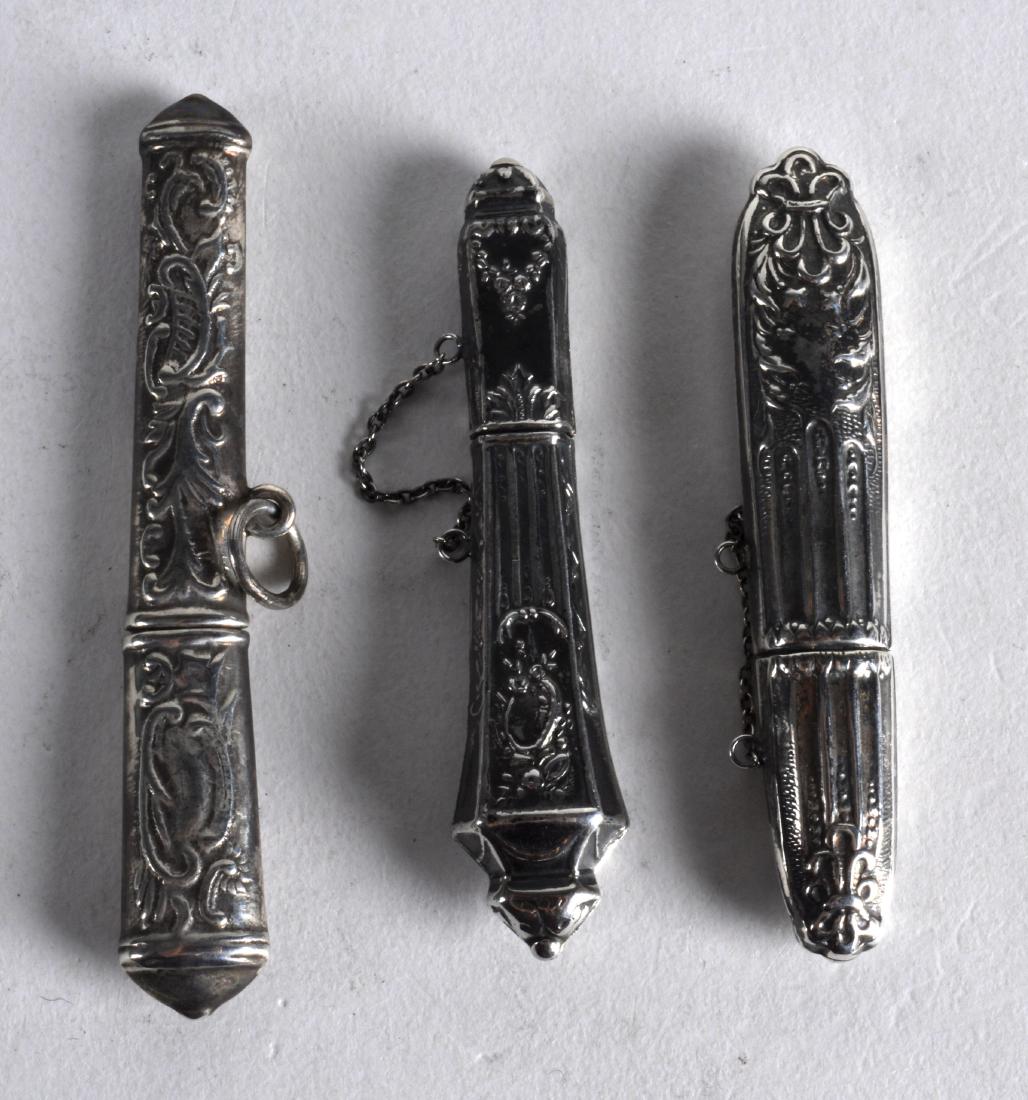 THREE NOVELTY SILVER NEEDLE CASES. (3): THREE NOVELTY SILVER NEEDLE CASES. (3)
