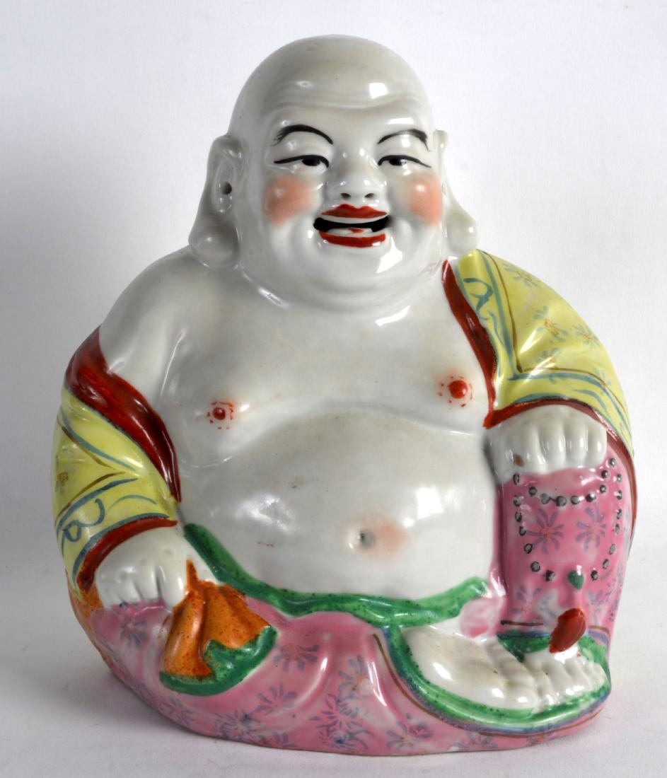A CHINESE REPUBLICAN PERIOD PORCELAIN FIGURE OF A: A CHINESE REPUBLICAN PERIOD PORCELAIN FIGURE OF A BUDDHA painted with floral sprays. Signed. 9.25ins high.