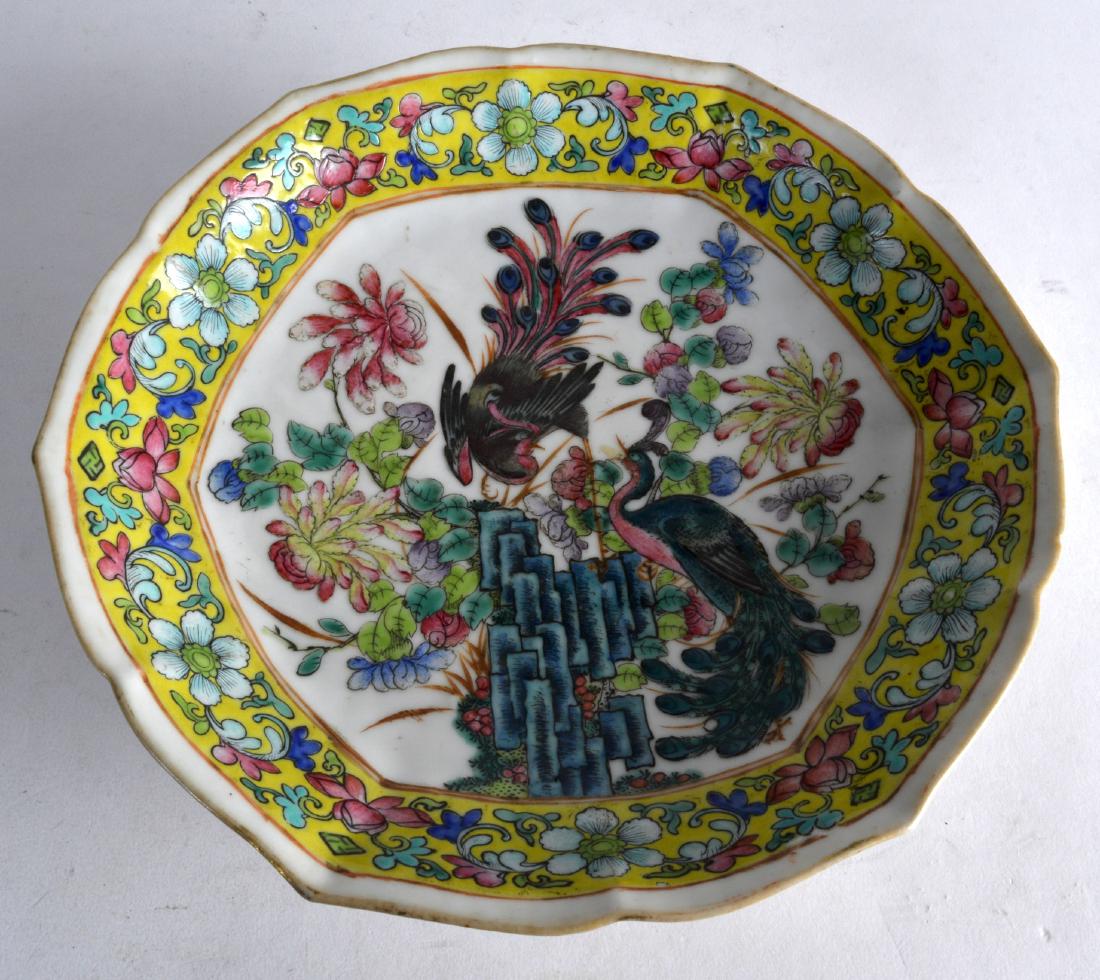 AN EARLY 20TH CENTURY CHINESE FAMILLE JAUNE LOBED: AN EARLY 20TH CENTURY CHINESE FAMILLE JAUNE LOBED FOOTED BOWL bearing Qianlong marks to base, painted with exotic birds upon hollow rock. 9.25ins wide.