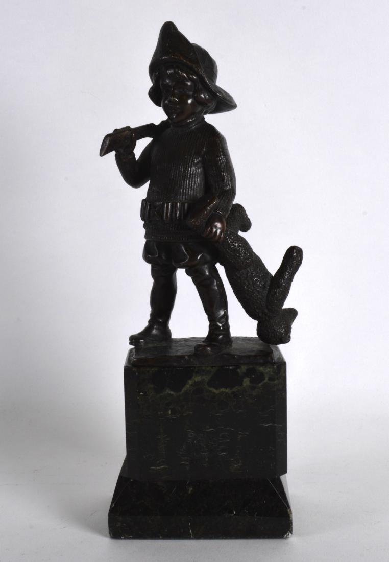 A LATE 19TH CENTURY EUROPEAN BRONZE FIGURE OF A CHILD: A LATE 19TH CENTURY EUROPEAN BRONZE FIGURE OF A CHILD HUNTER modelled holding a rifle in one hand, his teddy bear in the other. Signed. 10.75ins high.