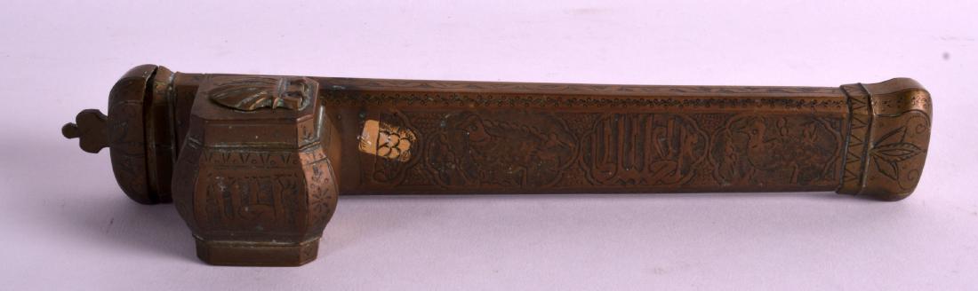 A 19TH CENTURY ISLAMIC BRASS PEN HOLDER with attached: A 19TH CENTURY ISLAMIC BRASS PEN HOLDER with attached inkwell, engraved with birds and flowers. 9.5ins wide.