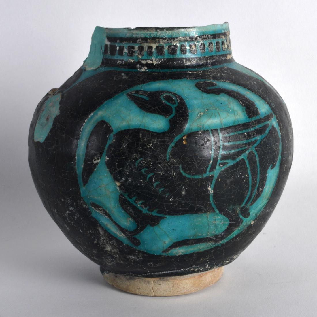 A Persian Silhouette Ware Vase, 12th/13th Century,: A Persian Silhouette Ware Vase, 12th/13th Century, painted with stylised birds. 6.25ins high.
