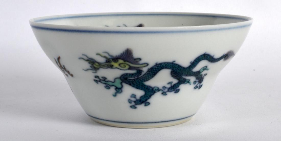 A CHINESE DOUCAI PORCELAIN OGEE FORM BOWL bearing: A CHINESE DOUCAI PORCELAIN OGEE FORM BOWL bearing Yongzheng marks to base, painted with stylised dragons. 4.25ins wide.