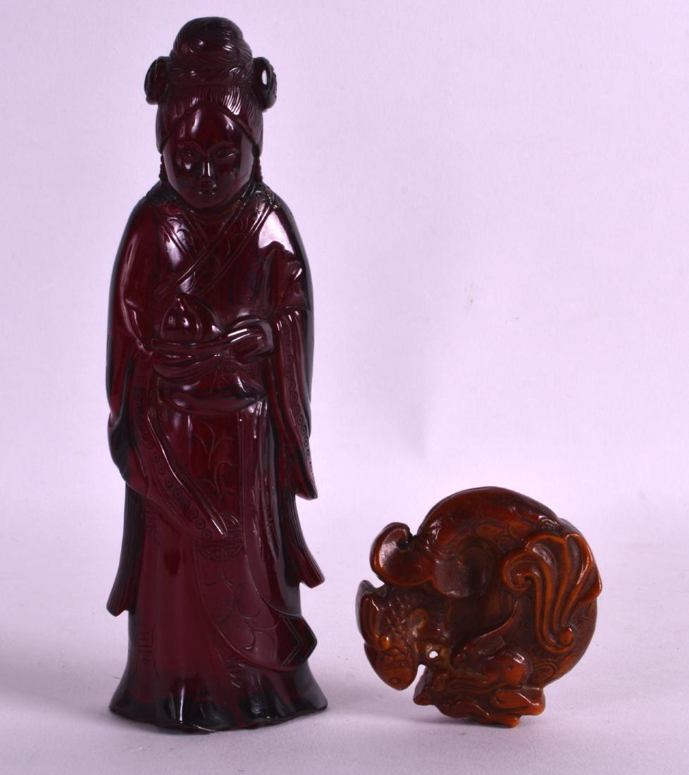 AN EARLY 20TH CENTURY CHINESE CARVED RED AMBER FIGURE (1 of 2)