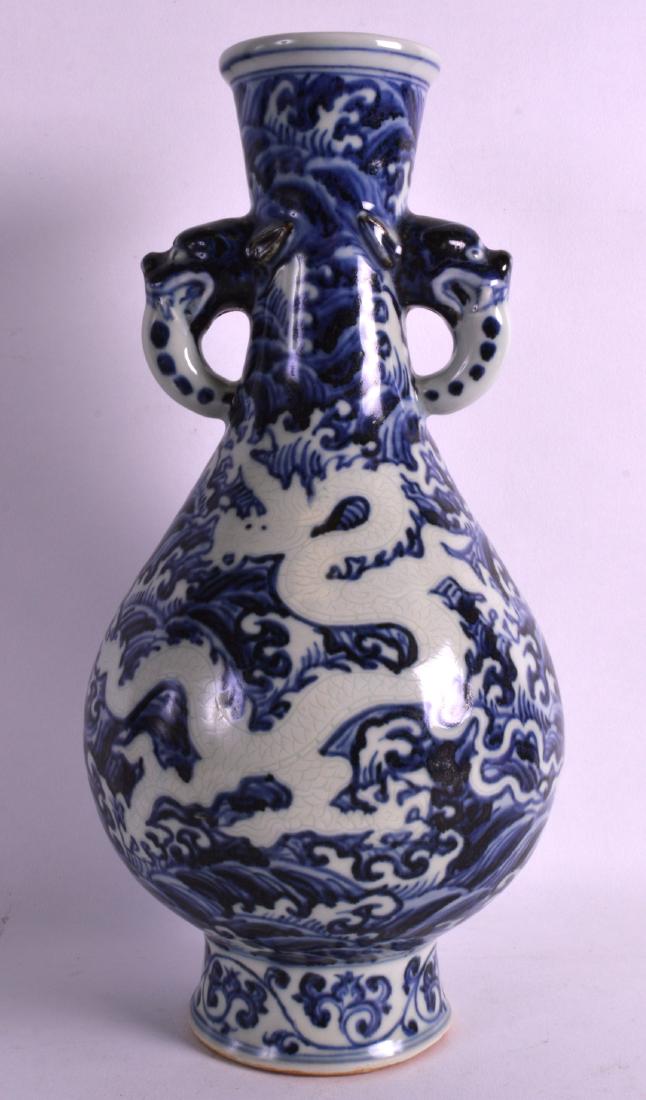 A CHINESE BLUE AND WHITE TWIN HANDLED VASE bearing (1 of 3)