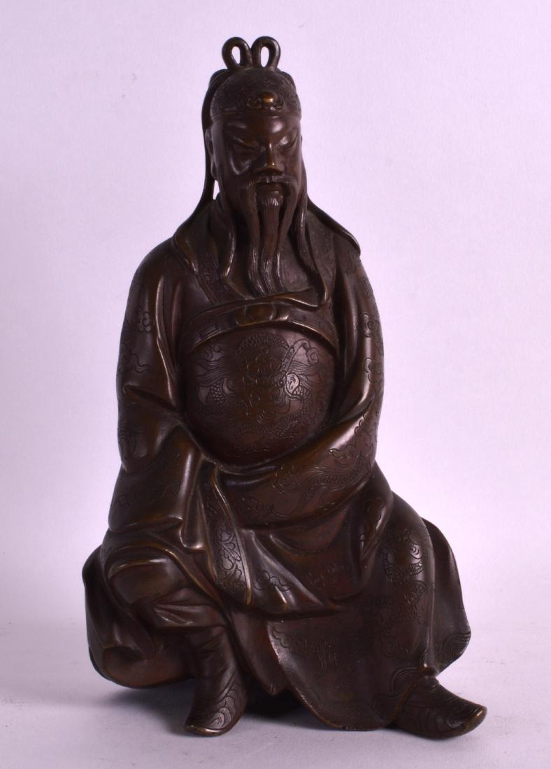 AN 18TH CENTURY CHINESE BRONZE FIGURE OF A SEATED MALE: AN 18TH CENTURY CHINESE BRONZE FIGURE OF A SEATED MALE SCHOLAR modelled in dragon embellished robes. 8.5ins high.