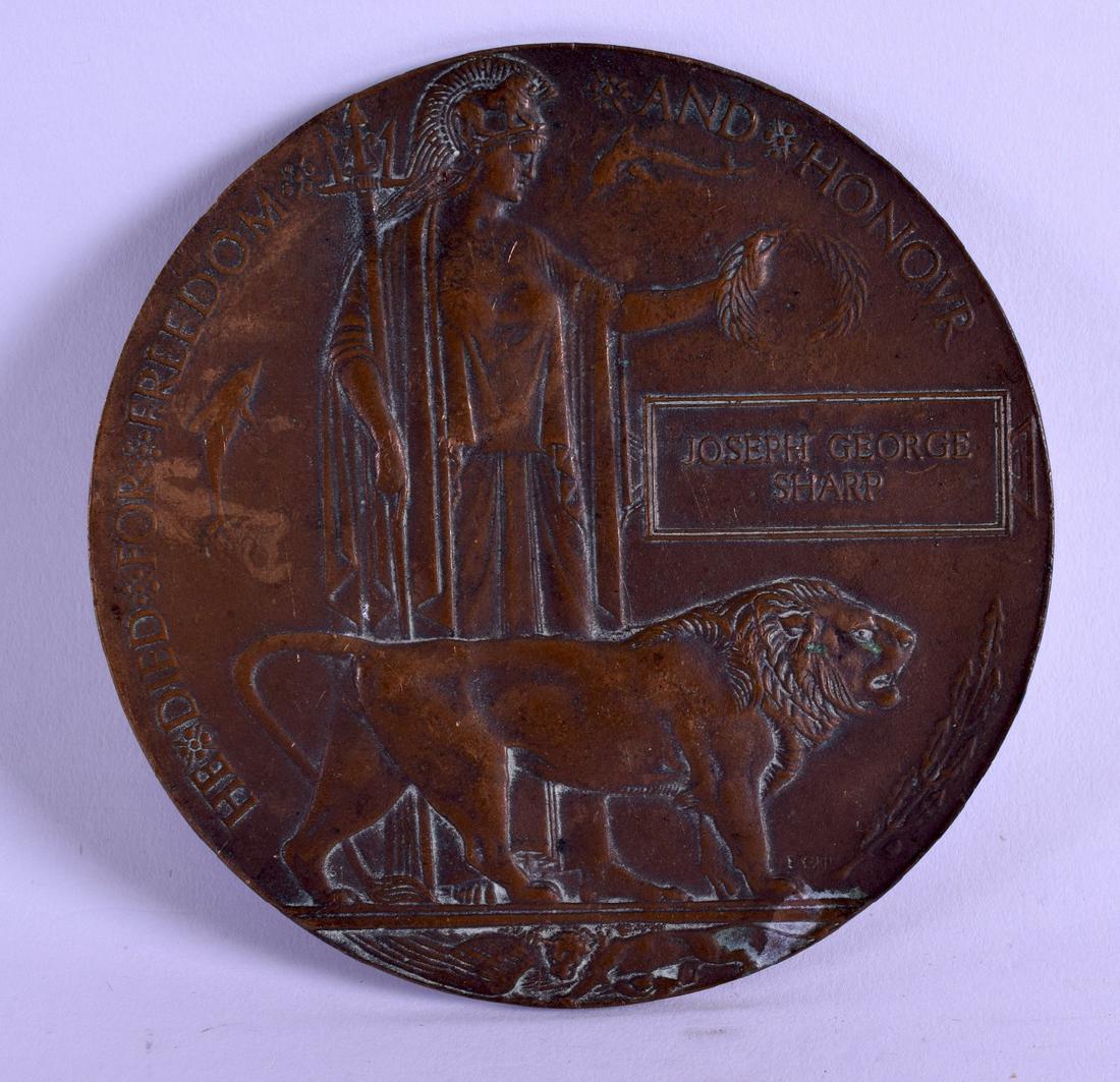 A WWI BRONZE DEATH PLAQUE commemorating Joseph George: A WWI BRONZE DEATH PLAQUE commemorating Joseph George Sharp. 12 cm diameter.