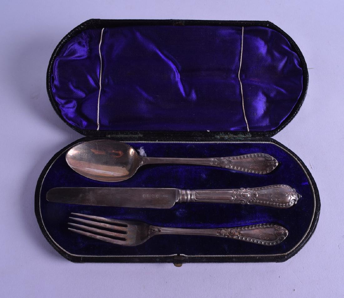 A VICTORIAN CASED SILVER KNIFE FORK AND SPOON SET. (1 of 1)