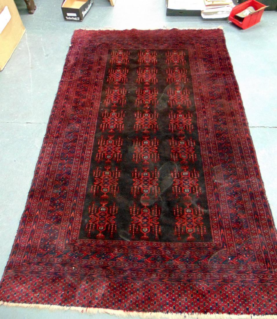 A RED GROUND PERSIAN RUG, decorated with motifs. 195 cm (1 of 3)