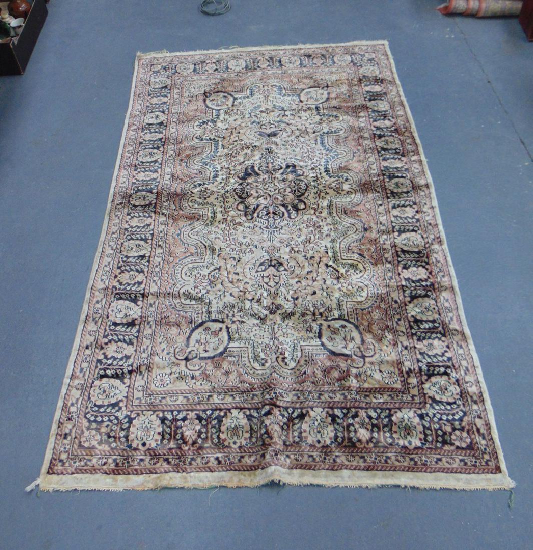 A BEIGE GROUND PERSIAN RUG, decorated with flowers. 202 (1 of 3)