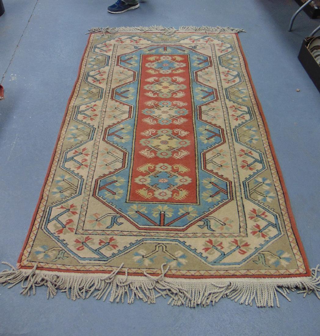 A BLUE GROUND PERSIAN RUG, decorated with flowers. 216 (1 of 3)