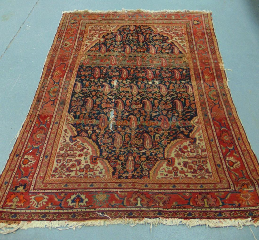 AN EARLY 20TH CENTURY PERSIAN RUG, decorated with (1 of 3)