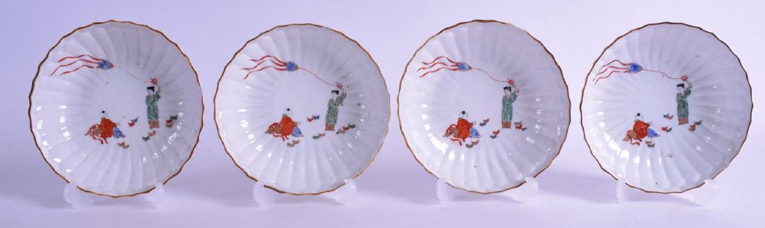 A SET OF FOUR 18TH CENTURY JAPANESE EDO PERIOD KAKIEMON: A SET OF FOUR 18TH CENTURY JAPANESE EDO PERIOD KAKIEMON DISHES painted with a figure within a landscape. 14 cm diameter. (4)