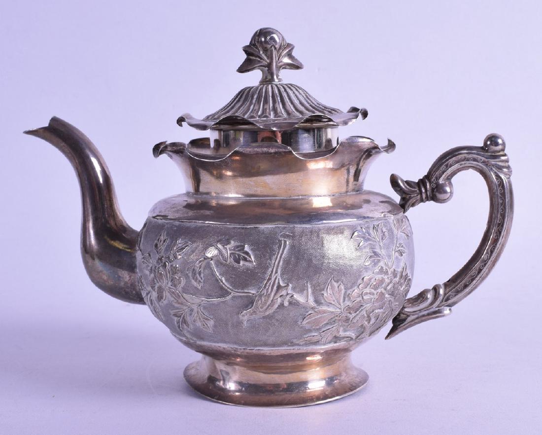 A LATE 19TH CENTURY CHINESE EXPORT SILVER TEAPOT AND (1 of 2)