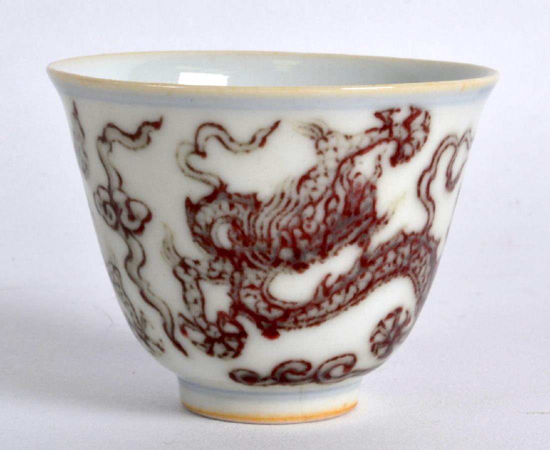A CHINESE IRON RED GLAZED PORCELAIN TEABOWL bearing (1 of 3)
