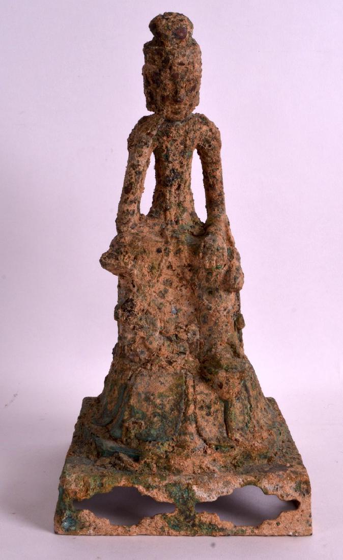 A CHINESE BRONZE FIGURE OF A SLENDER BUDDHIST modelled: A CHINESE BRONZE FIGURE OF A SLENDER BUDDHIST modelled seated upon a square base. 11.5ins high.