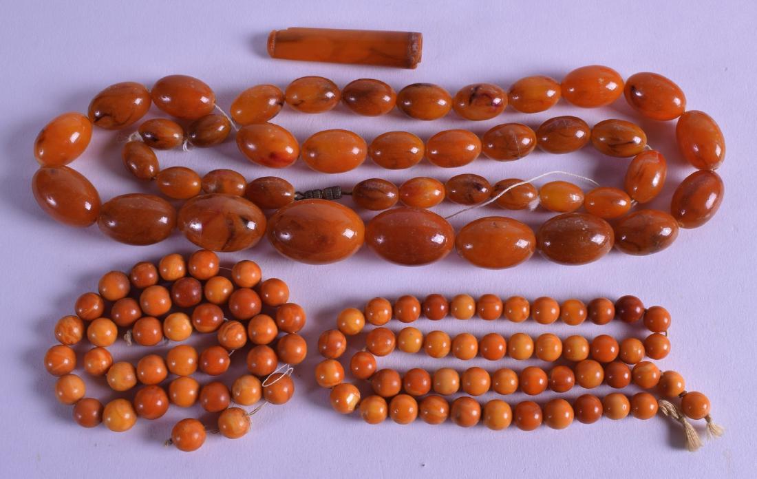 A PAIR OF EARLY 20TH CENTURY CARVED AMBER STRANDS (1 of 1)