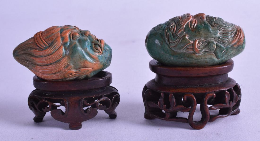 AN UNUSUAL PAIR OF HARDSTONE BUDDHISTIC GOD HEADS upon (1 of 2)