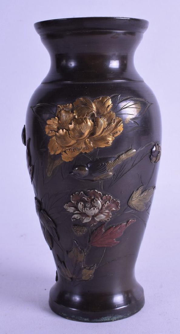 A 19TH CENTURY JAPANESE MEIJI PERIOD BRONZE VASE: A 19TH CENTURY JAPANESE MEIJI PERIOD BRONZE VASE decorated in relief with gold flowers, copper foliage and a bird.