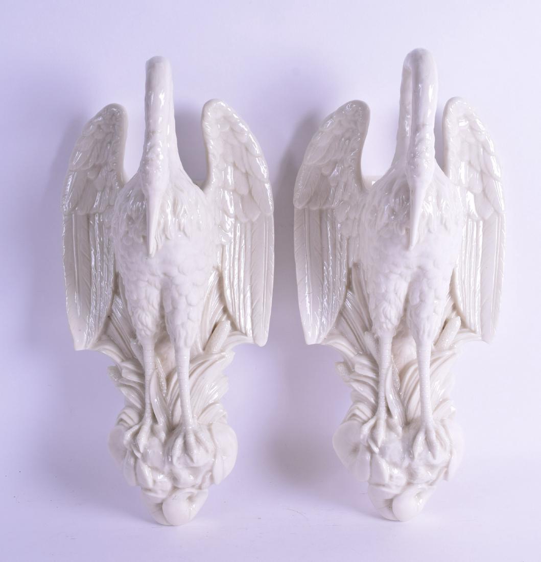 A PAIR OF 19TH CENTURY ROBINSON & LEADBEATER PORCELAIN: A PAIR OF 19TH CENTURY ROBINSON & LEADBEATER PORCELAIN WALL POCKETS in the form of stylised birds. 34 cm high.