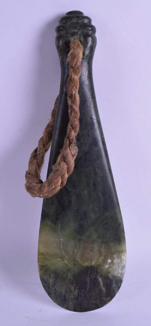 A GOOD NEW ZEALAND MAORI NEPHRITE PATU MERE CLUB of: A GOOD NEW ZEALAND MAORI NEPHRITE PATU MERE CLUB of flattened form with attached rope. 32 cm x 10 cm.