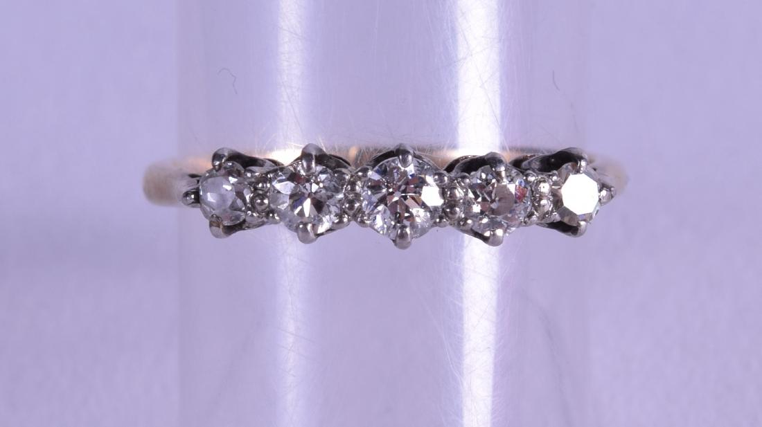 AN ANTIQUE 18CT GOLD FIVE STONE DIAMOND RING.: AN ANTIQUE 18CT GOLD FIVE STONE DIAMOND RING.