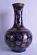 A CHINESE BLUE AND GILT GROUND PORCELAIN VASE bearing