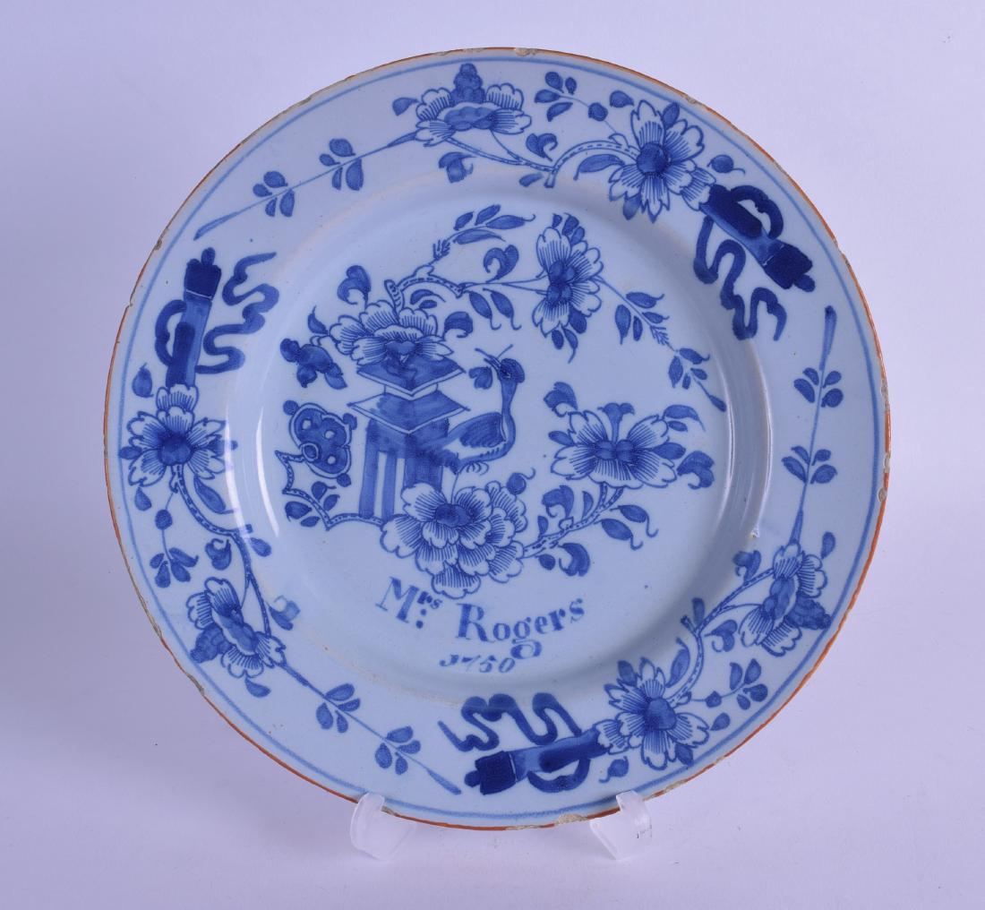 AN 18TH CENTURY DELFT BLUE AND WHITE CIRCULAR DISH: AN 18TH CENTURY DELFT BLUE AND WHITE CIRCULAR DISH entitled Mrs Rogers 1750. 21 cm diameter.