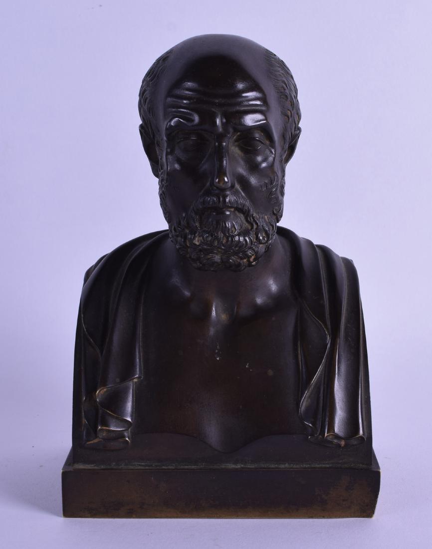 A 19TH CENTURY EUROPEAN BRONZE BUST OF A SCHOLAR: A 19TH CENTURY EUROPEAN BRONZE BUST OF A SCHOLAR modelled in open robes upon a square base. 17 cm x 10 cm.