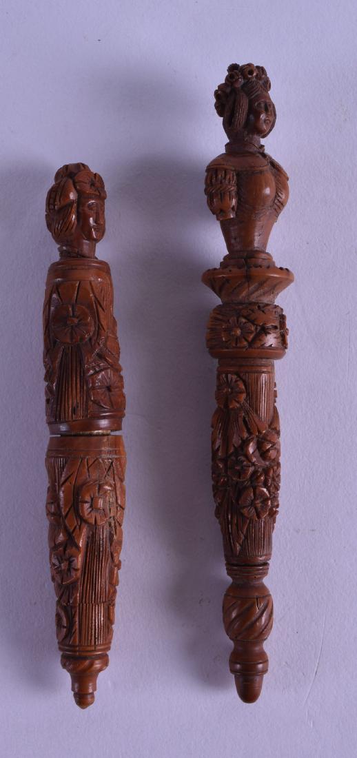 A NEAR PAIR OF 19TH CENTURY CONTINENTAL FRUITWOOD: A NEAR PAIR OF 19TH CENTURY CONTINENTAL FRUITWOOD NEEDLE CASES AND COVERS of figural form. 13 cm & 10.5 cm long. (2)