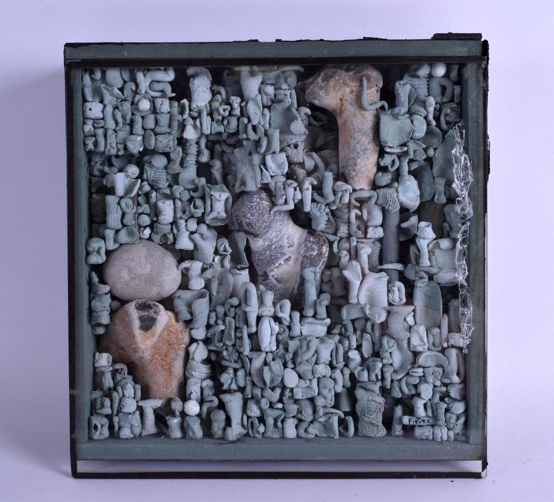 AN UNUSUAL FRAMED AND GLAZED MODERNIST SCULPTURE signed: AN UNUSUAL FRAMED AND GLAZED MODERNIST SCULPTURE signed Fievee, depicting various abstract stone and clay figures. 24 cm square.