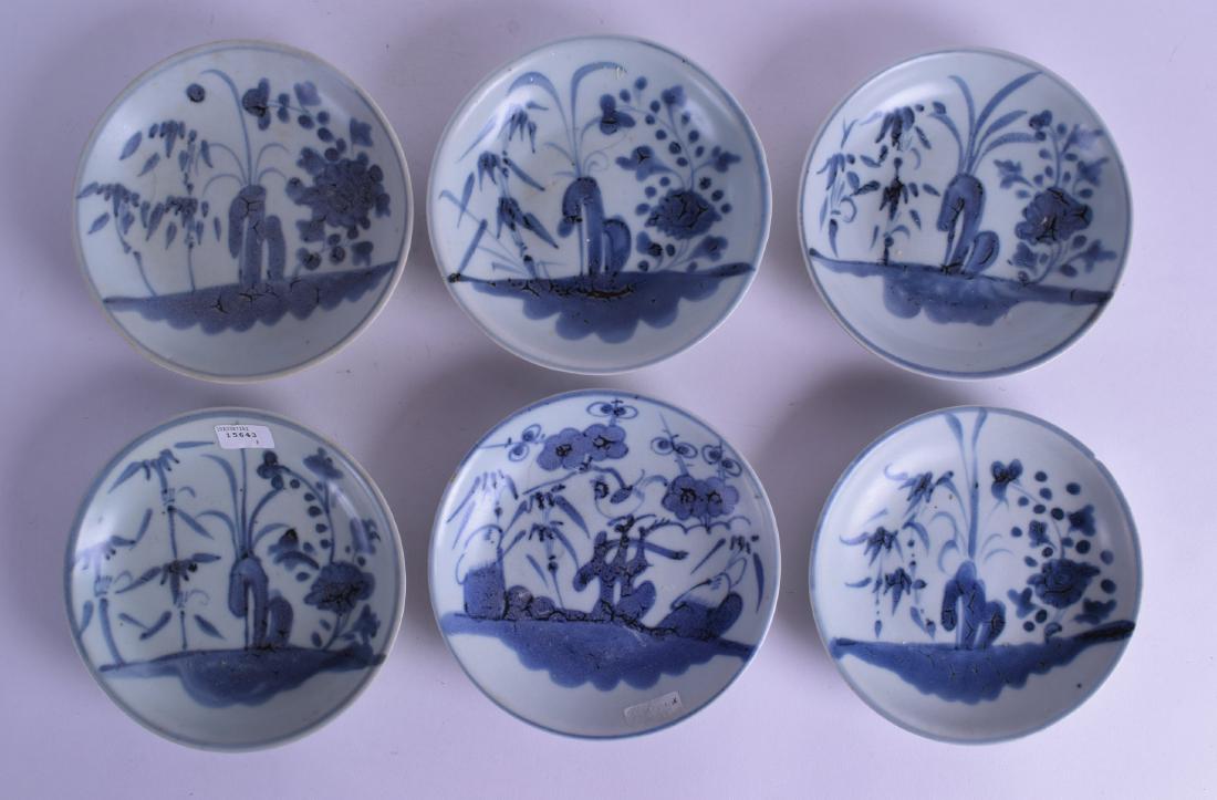 A SET OF SIX CHINESE TEK SING CARGO BLUE AND WHITE: A SET OF SIX CHINESE TEK SING CARGO BLUE AND WHITE DISHES painted with floral sprays and landscapes. 15 cm diameter.