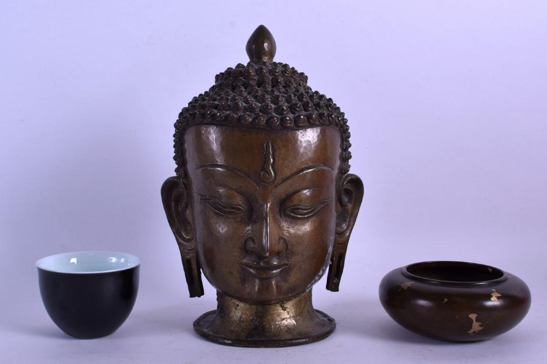 A 19TH CENTURY CHINESE BRONZE BUDDHA HEAD together with (1 of 2)