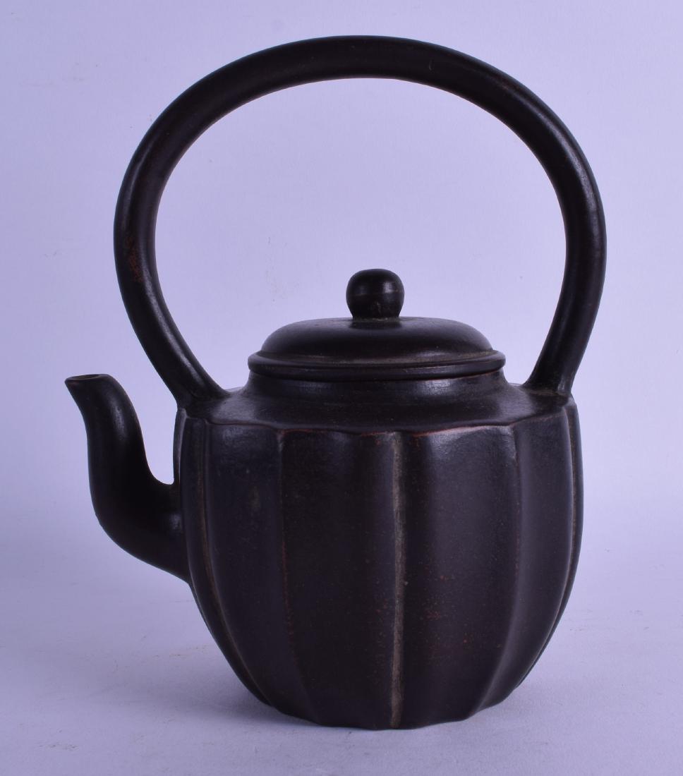 A CHINESE QING DYNASTY YIXING POTTERY TEAPOT AND COVER (1 of 3)