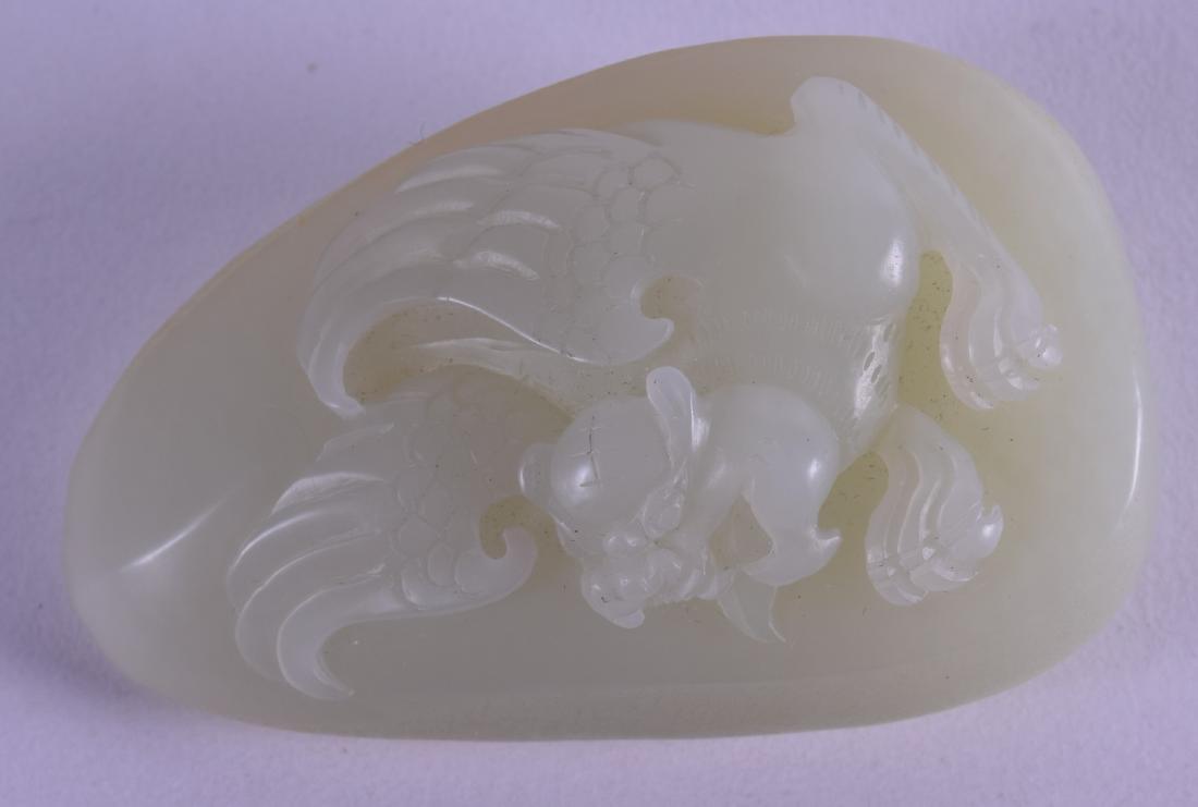 A CHINESE CARVED WHITE GREENISH JADE TABLET decorated (1 of 2)