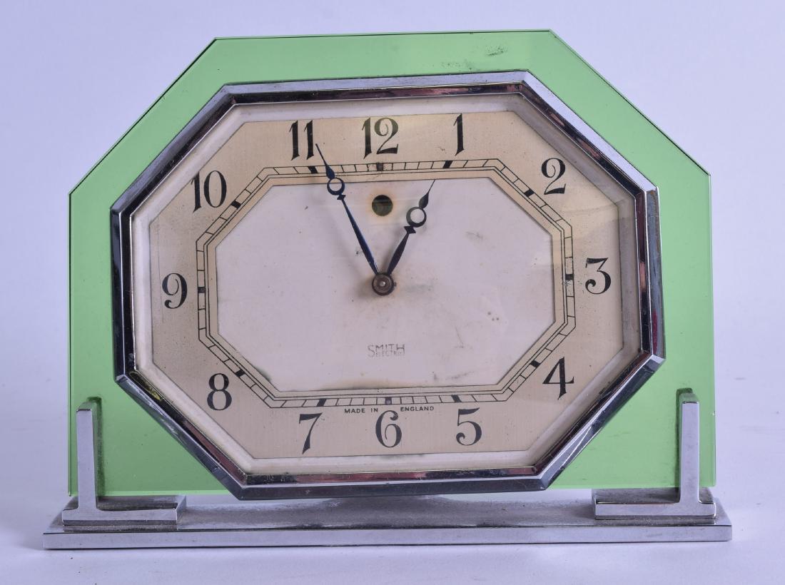 A STYLISH GREEN GLASS AND CHROME SMITH ELECTRIC MANTEL: A STYLISH GREEN GLASS AND CHROME SMITH ELECTRIC MANTEL CLOCK. 18 cm wide.