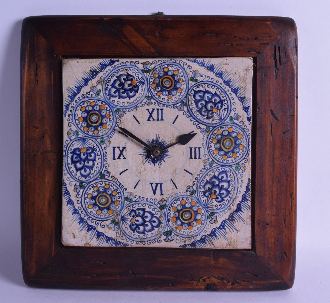 AN UNUSUAL CONTINENTAL FAIENCE POTTERY CLOCK within a (1 of 2)