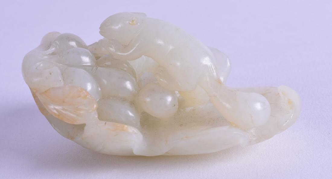 AN EARLY 20TH CENTURY CHINESE CARVED WHITE JADE FIGURE (1 of 3)