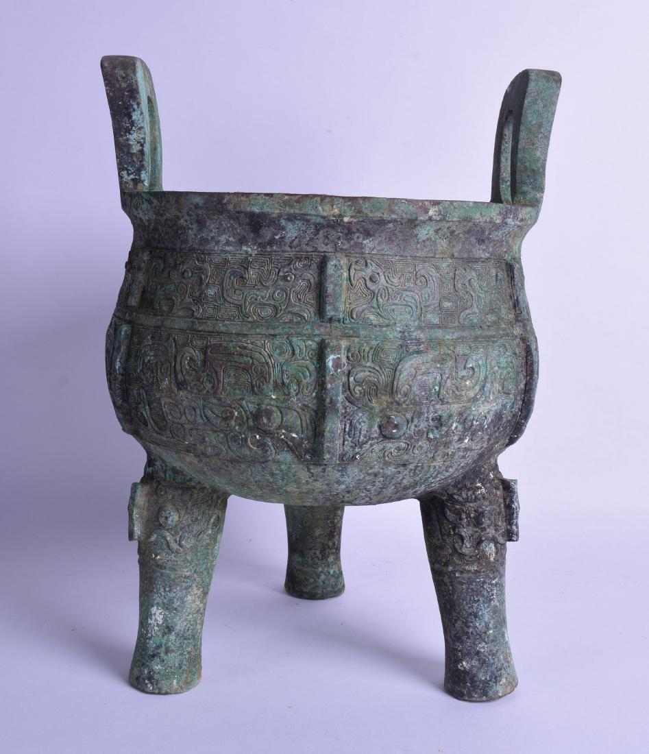 A LARGE CHINESE TWIN HANDLED ARCHAIC BRONZE CENSER (1 of 3)