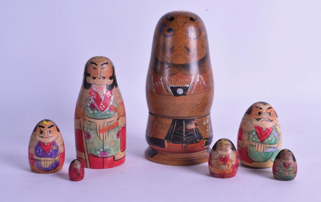 A RARE JAPANESE TAISHO PERIOD SET OF SEVEN SAMURAI: A RARE JAPANESE TAISHO PERIOD SET OF SEVEN SAMURAI NESTING DOLLS. Largest 13 cm high.