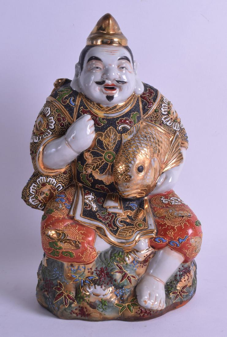 A JAPANESE TAISHO PERIOD SATSUMA FIGURE OF A FISHERMAN: A JAPANESE TAISHO PERIOD SATSUMA FIGURE OF A FISHERMAN modelled holding a carp in richly embellished robes. 29 cm high.