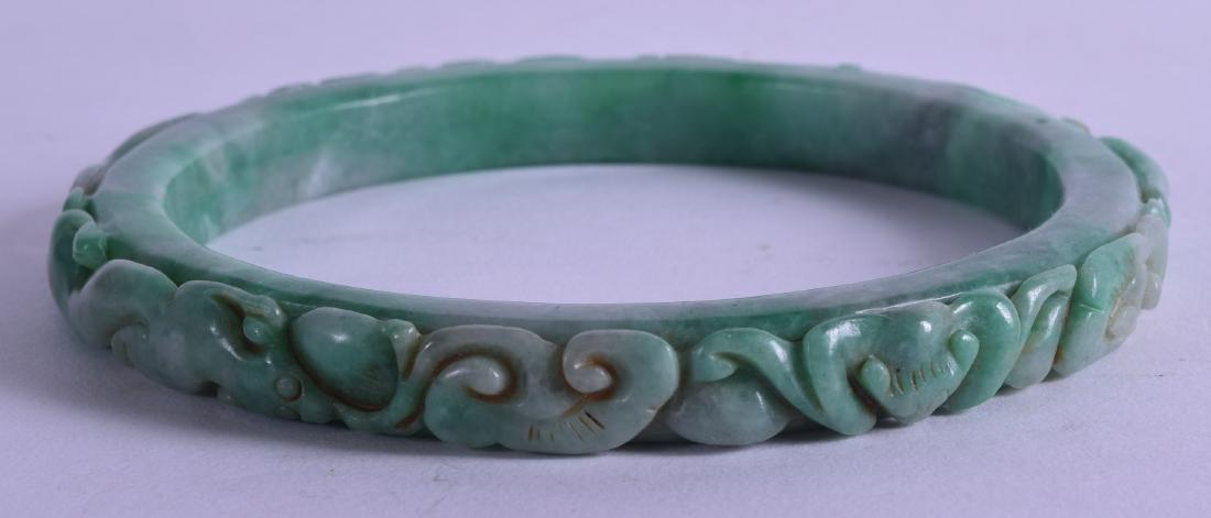A LARGE CHINESE CARVED JADEITE ARM BANGLE decorated (1 of 2)