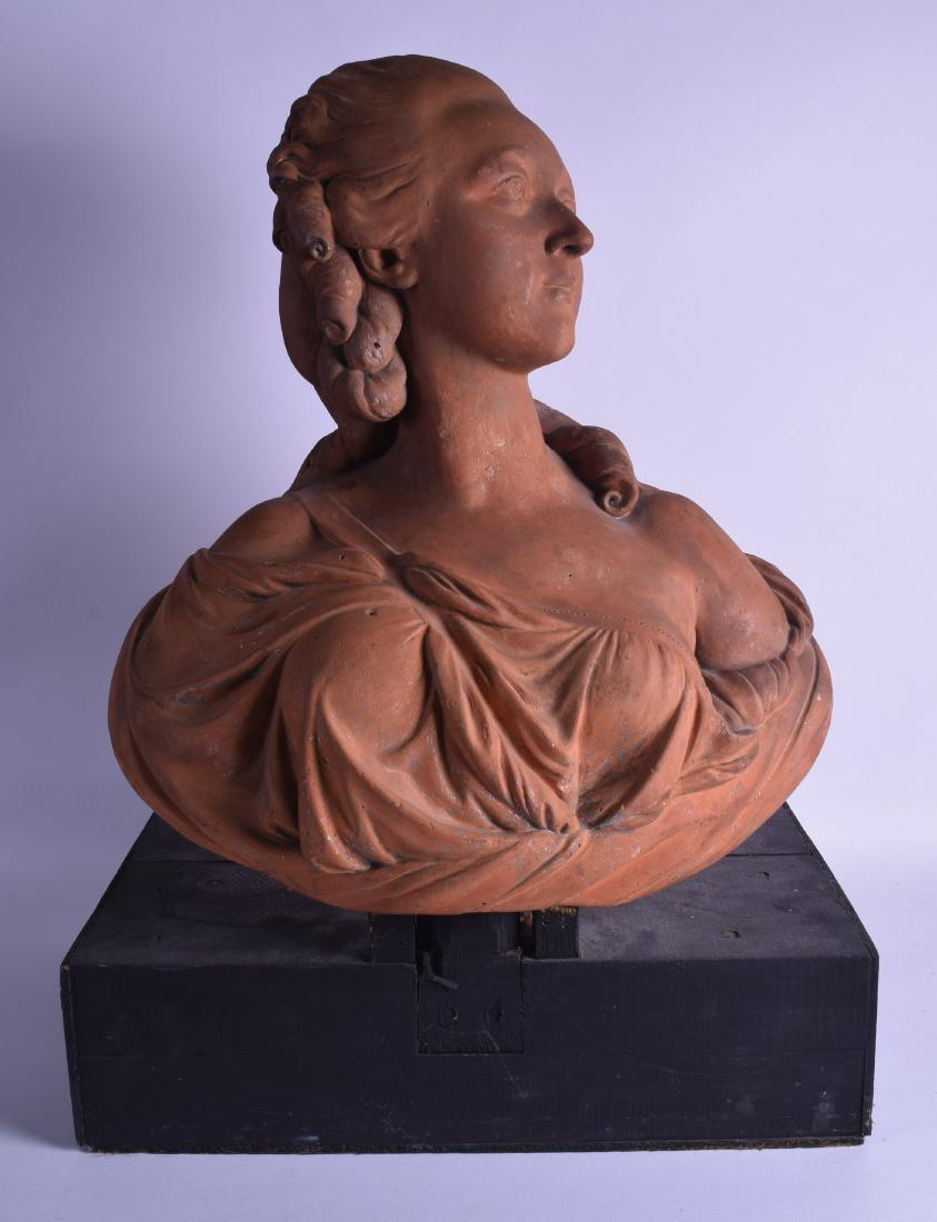 A FINE 18TH/19TH CENTURY FRENCH TERRACOTTA BUST OF: A FINE 18TH/19TH CENTURY FRENCH TERRACOTTA BUST OF MARIE-ANTOINETTE in the manner of Felix Lecomte, modelled upon an ebonised base. Bust 42 cm x 51.5 cm.