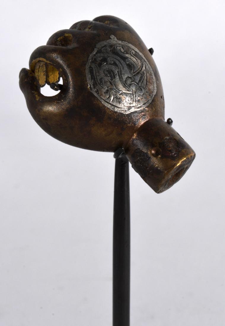 A Rare 12th/13th Century Islamic Gilt Bronze Back: A Rare 12th/13th Century Islamic Gilt Bronze Back Scratcher, in the form of a hand, silver inlaid with a motif. 1.25ins long.