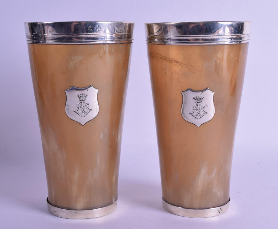 A LARGE PAIR OF VICTORIAN SILVER MOUNTED HORN BEAKERS: A LARGE PAIR OF VICTORIAN SILVER MOUNTED HORN BEAKERS by Thomas Johnson I. London 1874. 18.75 cm high.