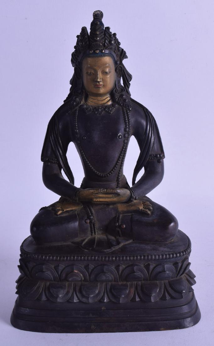 A CHINESE POLYCHROMED BRONZE FIGURE OF A SEATED BUDDHA: A CHINESE POLYCHROMED BRONZE FIGURE OF A SEATED BUDDHA with gilt face and hands, modelled upon a triangular base. 23.5 cm high.